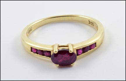 Oval Ruby Channel Ring in 14K Yellow Gold MAIN