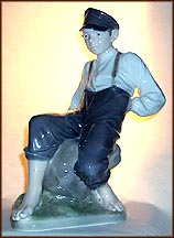 Boy On Stone, Royal Copenhagen Figurine #1659 MAIN