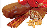 Pretzels smothered in caramel, wrapped with cashews or rice krispies (your choice) and dipped in Swiss chocolates. THUMBNAIL