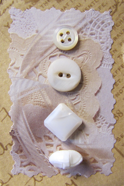 VINTAGE Miscellaneous White and Cream Buttons on Tan Card with White Lace MAIN