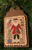 Homespun Elegance - 2021 Santa Ornament - Flag Waving Santa THUMBNAIL