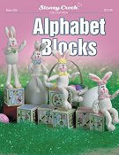 cover photo of Stoney Creek cross stitch Book 502 Alphabet blocks with stuffed bunnies sitting on plastic canvas blocks THUMBNAIL